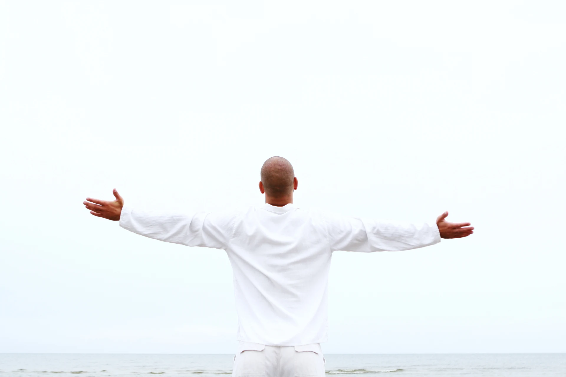 Man with a clean shaved-head look and natural hairline achieved with scalp micropigmentation